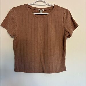 Brand is Bozzolo. Size L. Color is tan. Ribbed material.